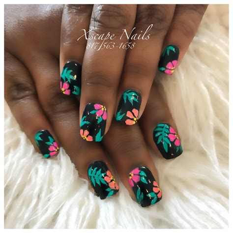 Using the same nail art brush, add orange details onto the petals and add the center of each flower as pictured. . Hawaiian nail design ideas